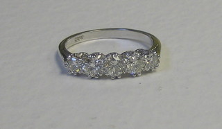A lady's 18ct white gold dress ring set 5 diamonds (approx 1.10ct)