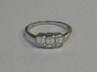 A lady's 18ct gold engagement/dress ring set 3 baguette cut diamonds (approx 1.25ct)