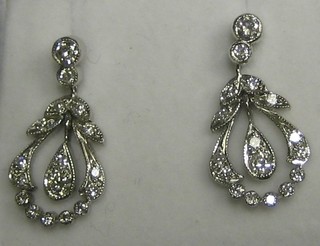 A pair of lady's attractive diamond drop earrings (approx 0.70ct)