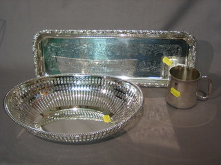 A rectangular silver plated bottle tray 14", a pierced silver plated oval dish 10" and a silver plated christening tankard