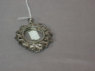A Continental pierced silver double sided locket 3"