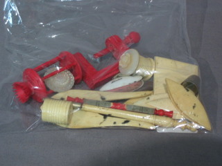 A red carved ivory cotton reel clamp, 2 ivory tape measure cases and various other curios (15)
