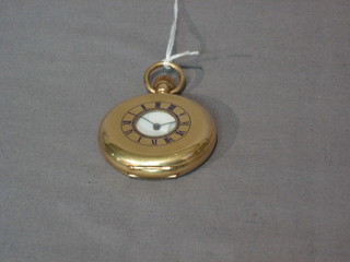 A Waltham pocket watch contained in a gold plated demi-hunter case