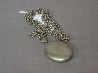 A silver chain hung a locket