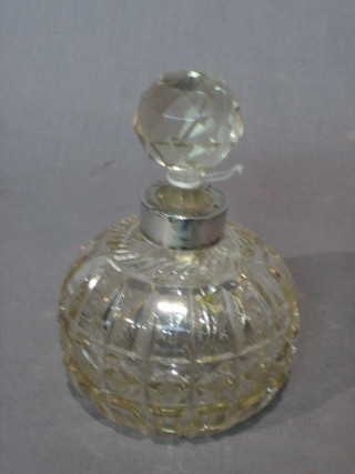 A cut glass globular shaped scent bottle with silver collar 3"
