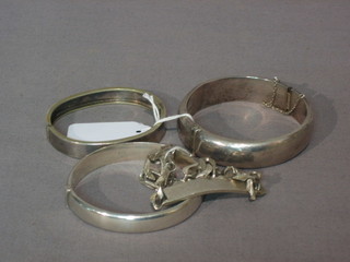 3 silver bangles and a silver bracelet