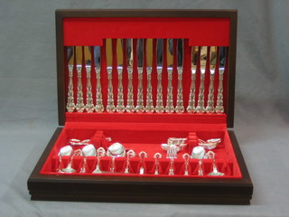 A modern canteen of silver plated cutlery contained in a mahogany box