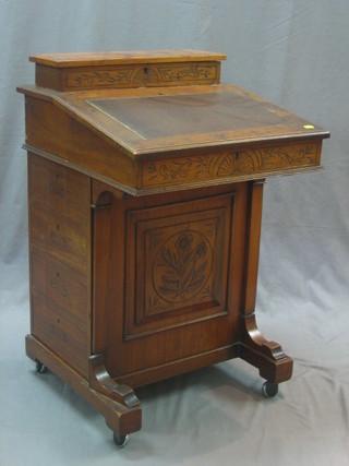 An Edwardian walnut Davenport, the back with stationery box and hinged lid, the pedestal fitted 4 long drawers 21"