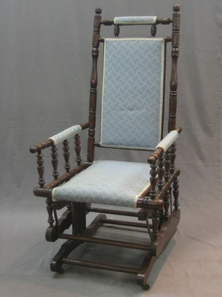 An American turned mahogany rocking chair with bobbin turned decoration