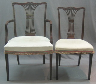 A set of 6  Hepplewhite style camel back dining chairs with pierced vase shaped splat backs and upholstered seats, raised on square tapering supports