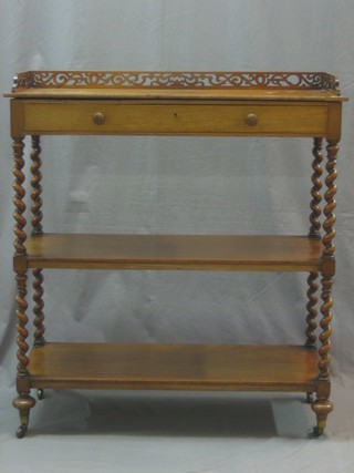 A Victorian bleached mahogany 3 tier what-not with pieced three-quarter gallery, the top fitted a drawer and raised on spiral turned supports by Hindley & Sons, Late Miles & Edwards 134 Oxford St London, also marked 2549 3133 34"