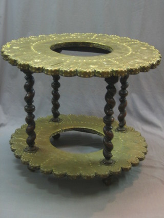 An Antique French 2 tier embossed metal brazing table, raised on spiral turned supports 36"