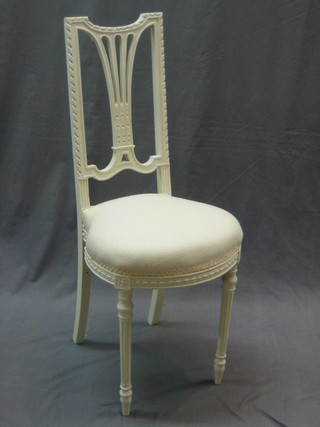 An Edwardian white painted mahogany high backed chair with upholstered seat, raised on turned and fluted supports