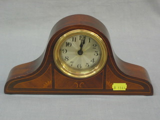 A bedroom timepiece with silvered dial and Arabic numerals contained in an arch shaped case
