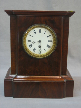 An Edwardian mantel clock with porcelain dial and Roman numerals contained in a mahogany case