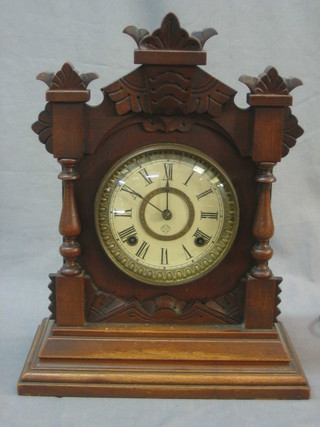 An Ansonia 8 day striking bracket clock with paper dial and Roman Numerals contained in a pine case