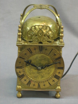 An electric operated brass lantern clock with 4 1/2" dial