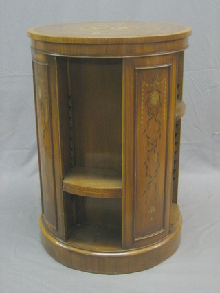 A 20th Century Georgian style painted satinwood revolving bookcase, the interior fitted adjustable shelves 23"