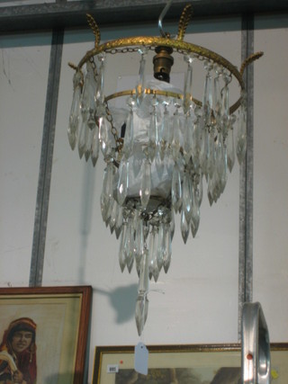 A glass 4 tier circular drop electrolier hung gilt lozenges 