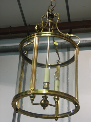 A handsome 19th Century style 3 light lantern contained in a circular gilt metal and glass shade