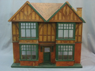 A 1930's wooden dolls house 25"
