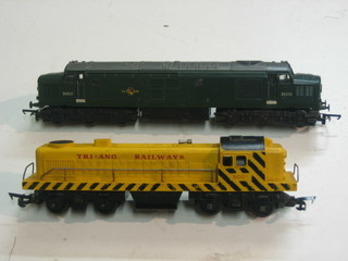 A Triang double headed diesel locomotive in green British Railway livery and a Triang Railways diesel locomotive