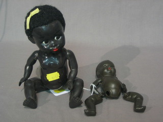 A Rosebud black doll with open and shutting eyes, articulated body 4" and 1 other black doll 9"