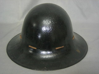 A WWII fire warden's helmet complete with liner