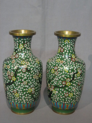 A pair of green ground and floral patterned cloisonne club shaped vases 10"