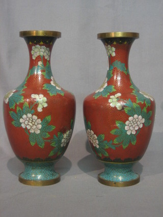 A pair of red ground cloisonne enamelled club shaped vases 10"