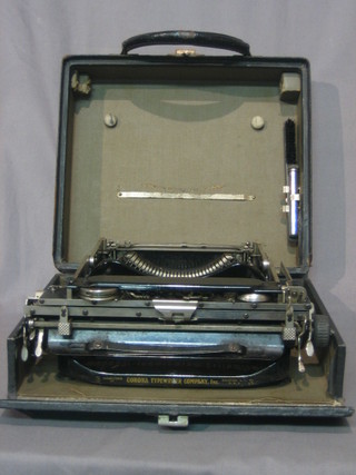 A Corona portable manual typewriter contained in a fibre carrying case