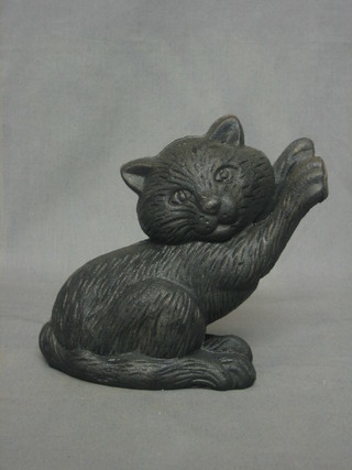 An iron figure of a seated cat 7"