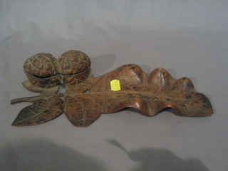 An Eastern carved wood inkwell in the form of a leaf and 2 walnuts 12"