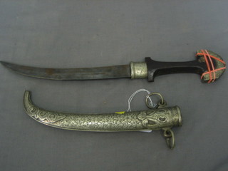 An Eastern dagger contained in a white metal scabbard 15"