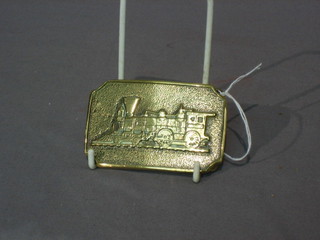 An American brass belt buckle decorated a steam locomotive the reverse marked BTS 3"