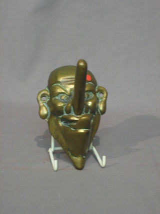 A 19th Century brass coat hook in the form of a Tengu mask - Gentleman with large nose and stuck out tongue 6"