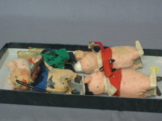 4 Schuko clockwork models of musical pigs, bases marked Schuko Patent, made in Germany, together with 3 Walt Disney pig tooth brushes