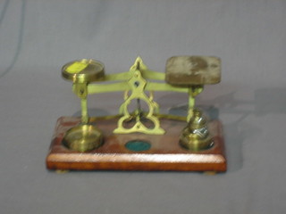 A pair of postage scales complete with weights