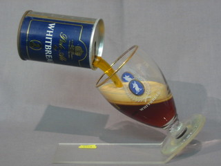 A Whitbread advertising bar ornament in the form of a can of beer being poured into a glass