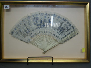 A 19th Century pierced ivory Oriental fan, framed 16"