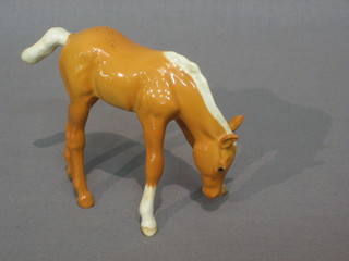 A Beswick figure of a standing Palomino foal 3"