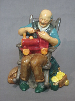 A Royal Doulton figure The Toy Maker HN2250