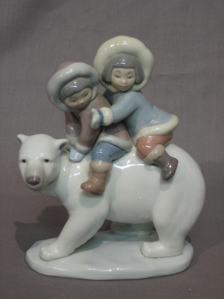 A Lladro figure of 2 seated children on a polar bear 6"
