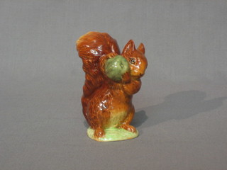 A Beswick Beatrix Potter figure Squirrel Nutkin, base with gold mark and F Warren & Co  Copyright