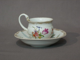 A Meissen cup and saucer with floral decoration and gilt banding, the base with crossed swords and impressed 14 16