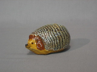 A Wade ornament in the form of a hedgehog 4" (chipped)