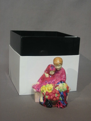 A miniature Royal Doulton figure of a street vendor - Flower Sellers Children