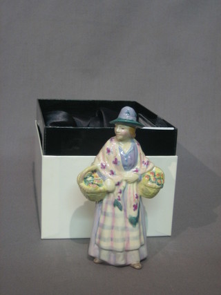 A miniature Royal Doulton figure of a street vendor - Romany Sue