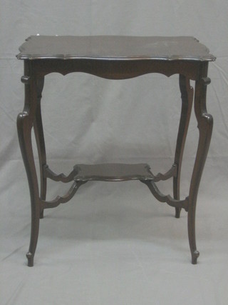 An Edwardian shaped mahogany 2 tier occasional table, raised on cabriole supports 34"
