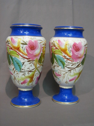 A pair of Victorian porcelain vases with floral decoration, blue and gilt banding 13"